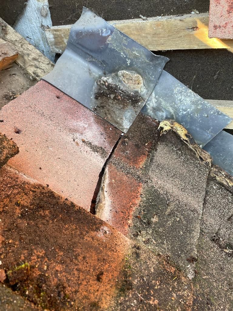 Cornerstone Roofing repairing damaged roof tiles in Sussex