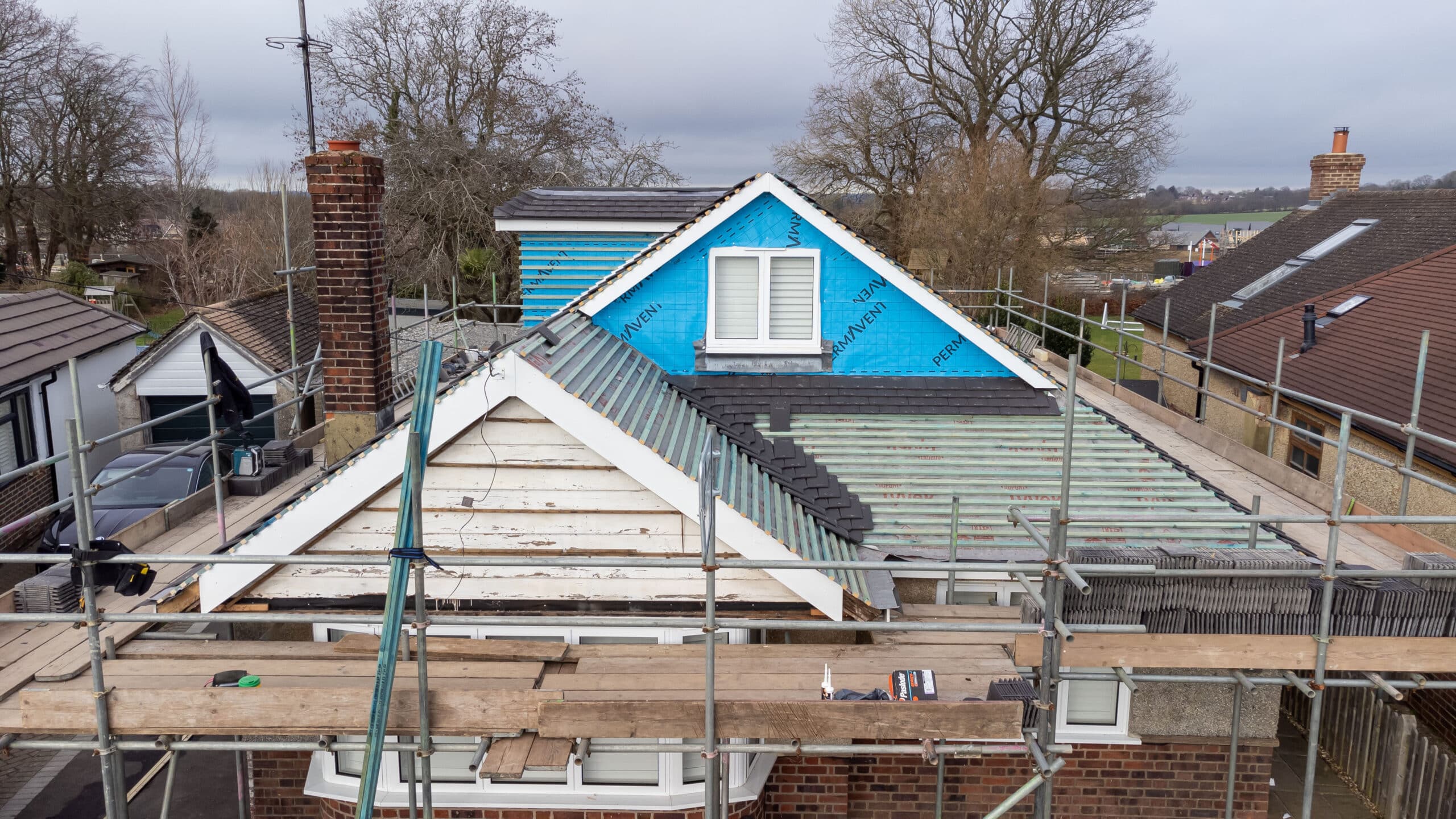 Aerial drone view of a Cornerstone Roofing pitched-roof project in Sussex